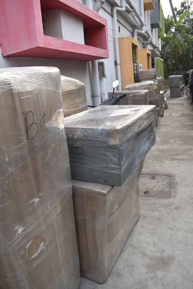Warehouse workers carrying boxes